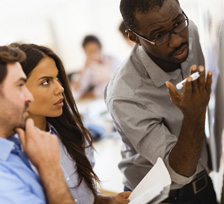 Image of consultant and two employees